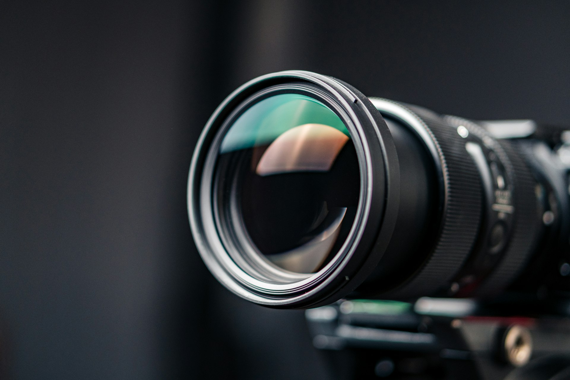 a close up of a camera lens on a tripod